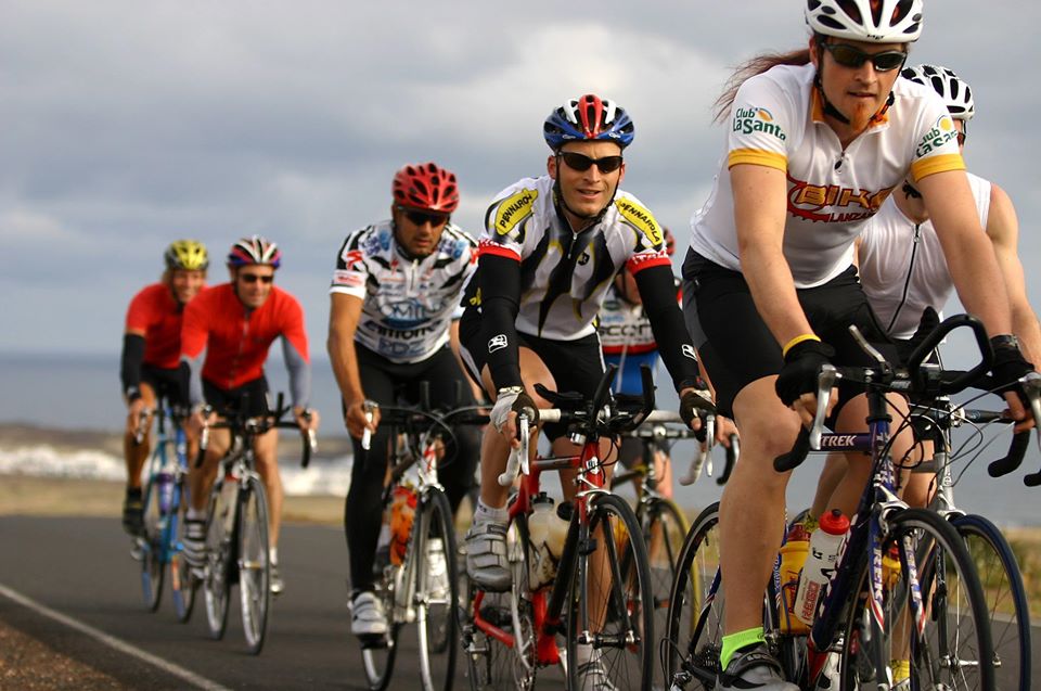 Cyclist riding their bikes through Lanzarote, taking part in the Long Distance Triathlon event at Club La Santa
