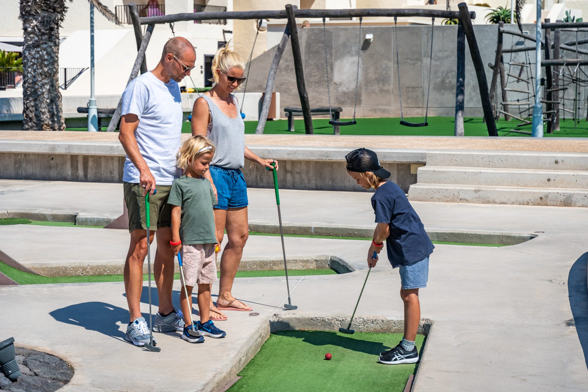 A family taking part in the mini golf at Club La Santa Lanzarote.