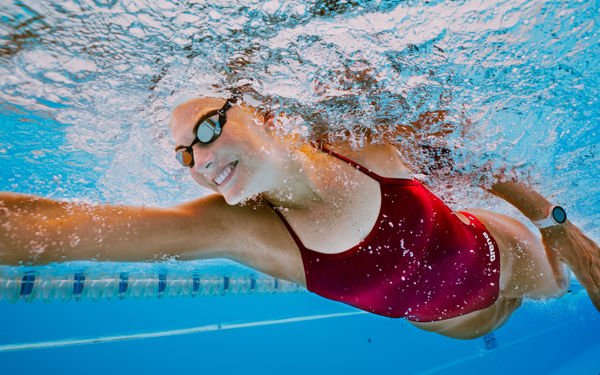 A women swimming in a pool at Club La Santa Lanzarote, taking part in the Swim Camp event.