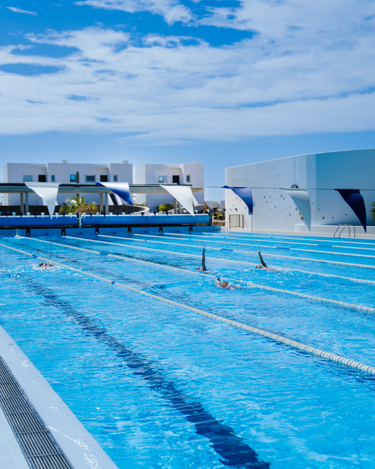 Swimmers swimming at Club La Santa Lanzarote.