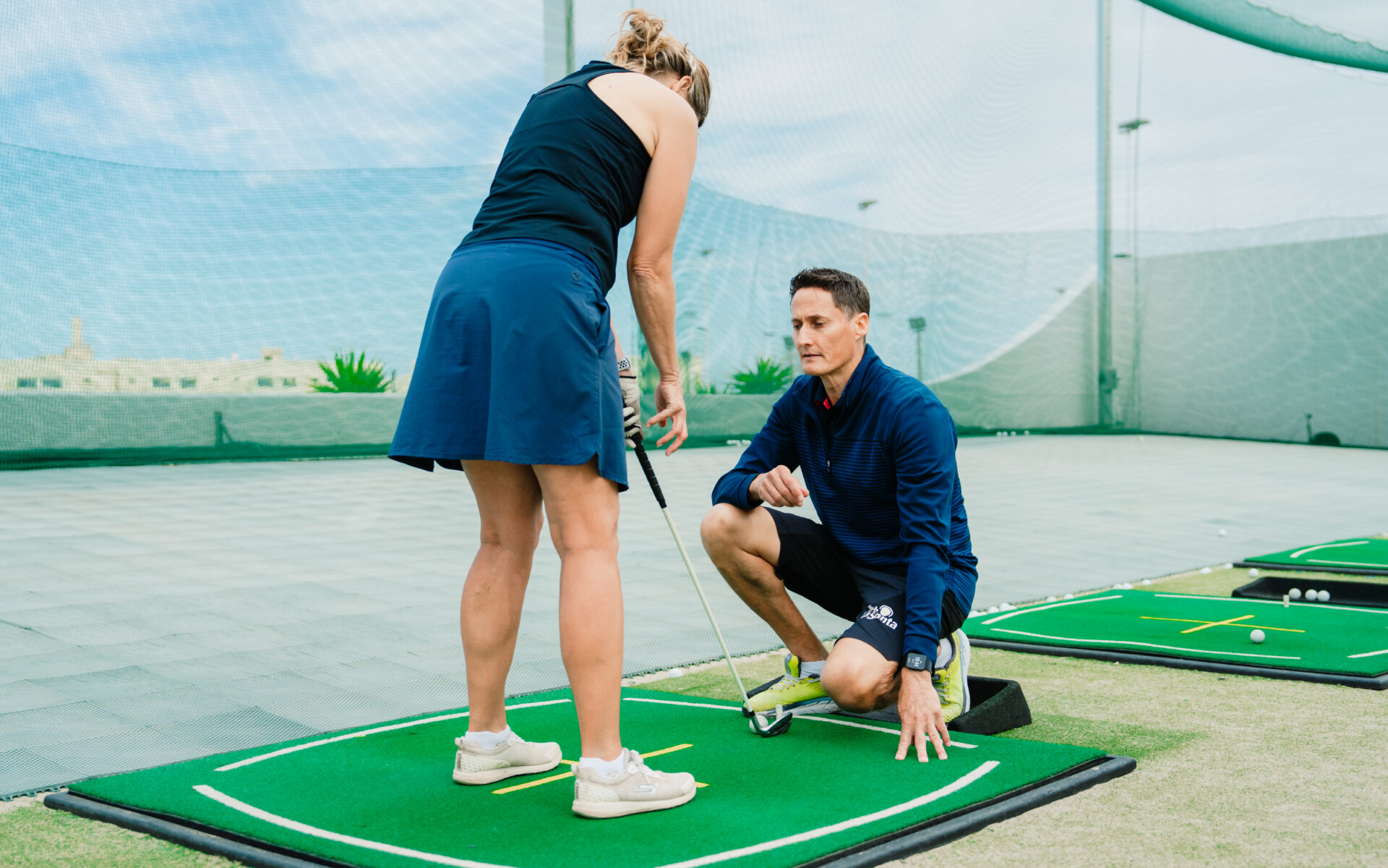 A women having a golf lesson with one of the instructors at Club La Santa Lanzarote.