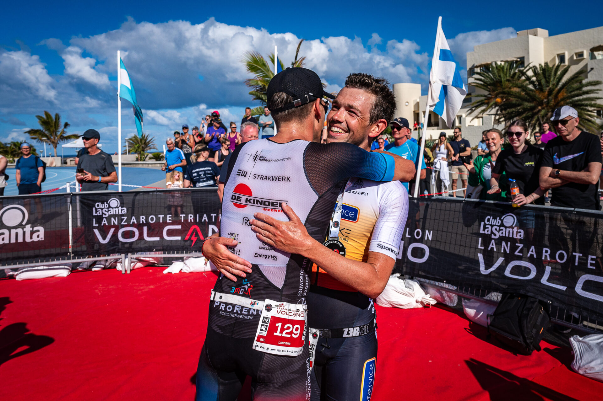 Two people hugging after taking part in the Volcano Triathlon at Club La Santa in Lanzarote
