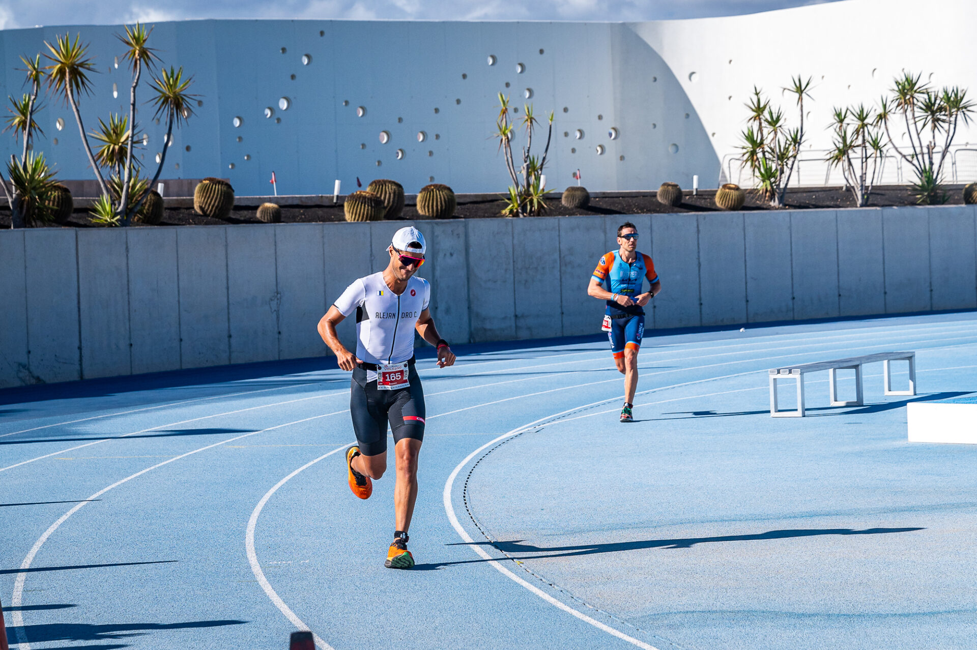 Runners takin part in the Volcano Triathlon at Club La Santa in Lanzarote. Running around a track.