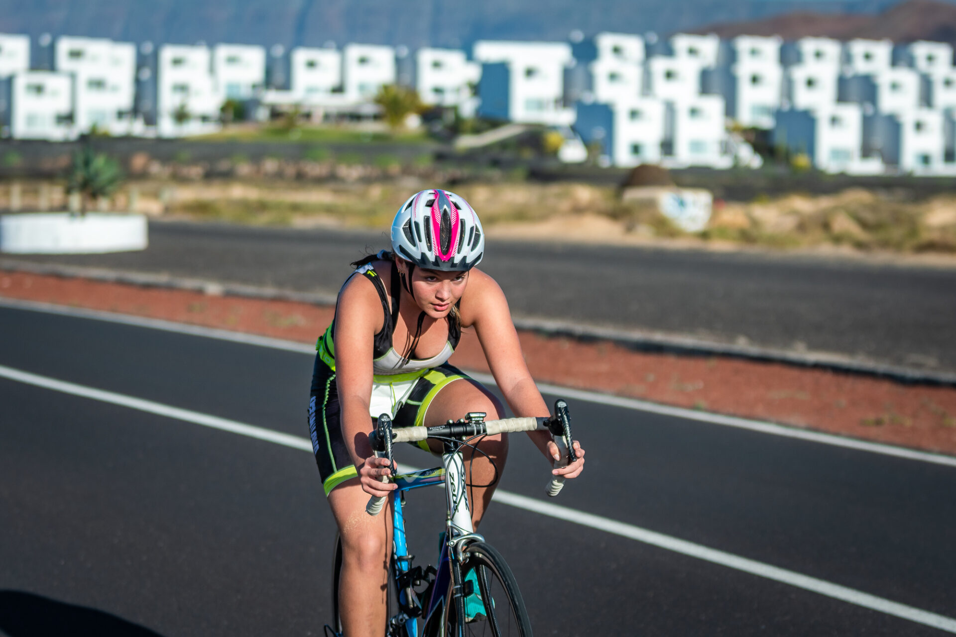 A young girl cycling around Lanzarote taking part in the Volcano Kids event at Club La Santa.